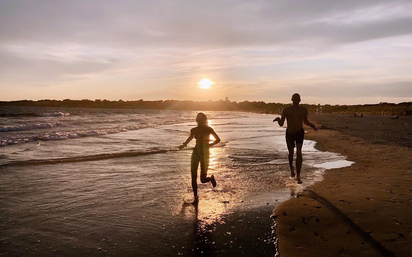 Dr Catherine swimming on Sachuest Beach at sunset in Newport