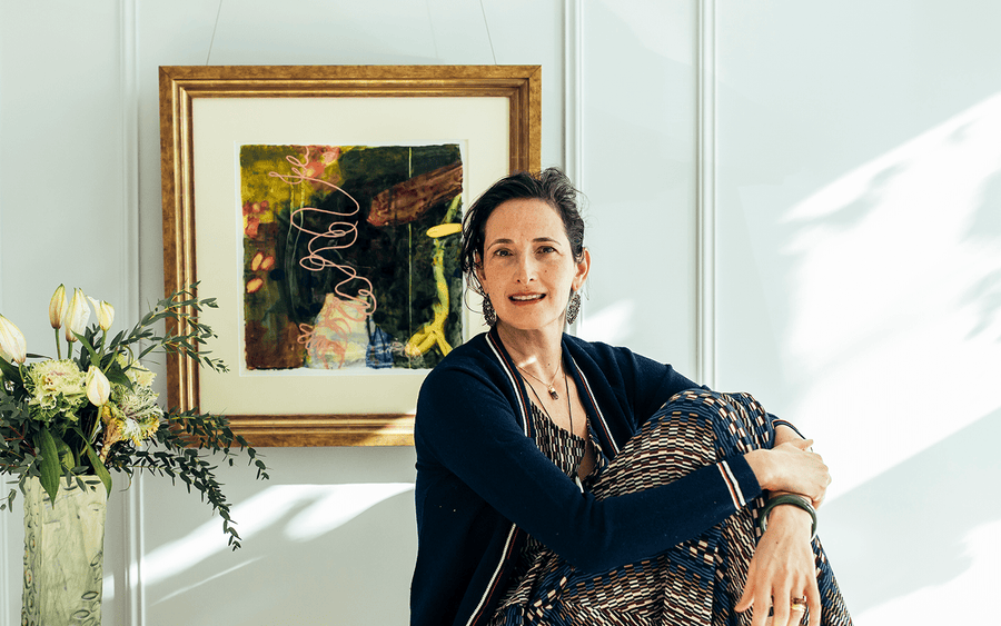 Dr. Catherine Price smiling warmly in her sunlit home, embodying ease and vitality